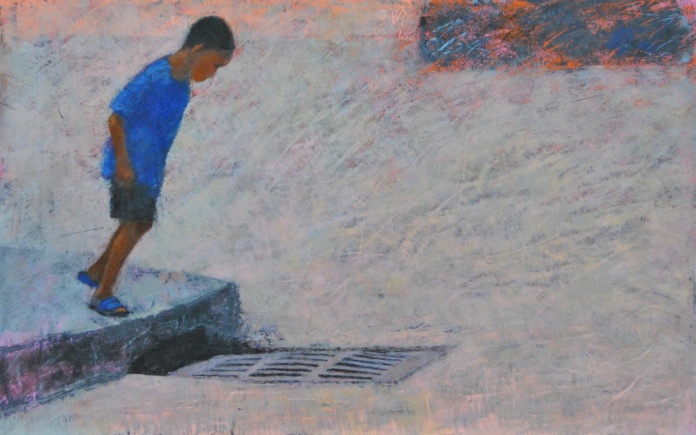 A kid looking down at a street drain